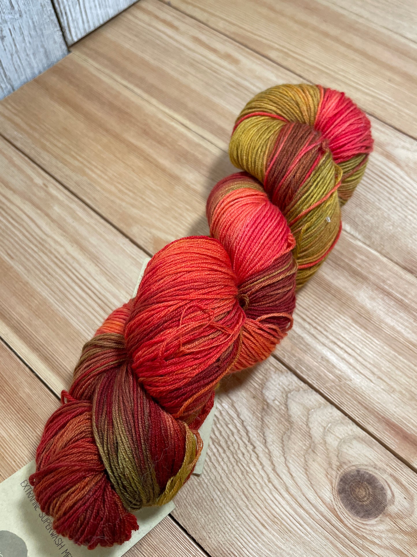 DISCONTINUED Urth Yarns Merino Sock Red and Gold 2031 Hand Painted Fingering Weight Wool Yarn Full Skein