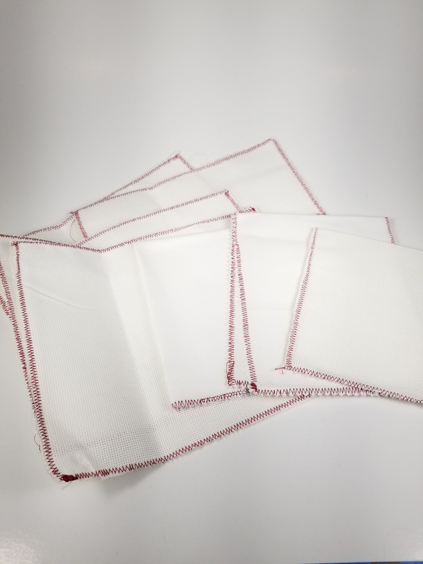 Seven pieces of 18 count Adia cross stitch fabric material multiple sizes White Pre-Bound Edges
