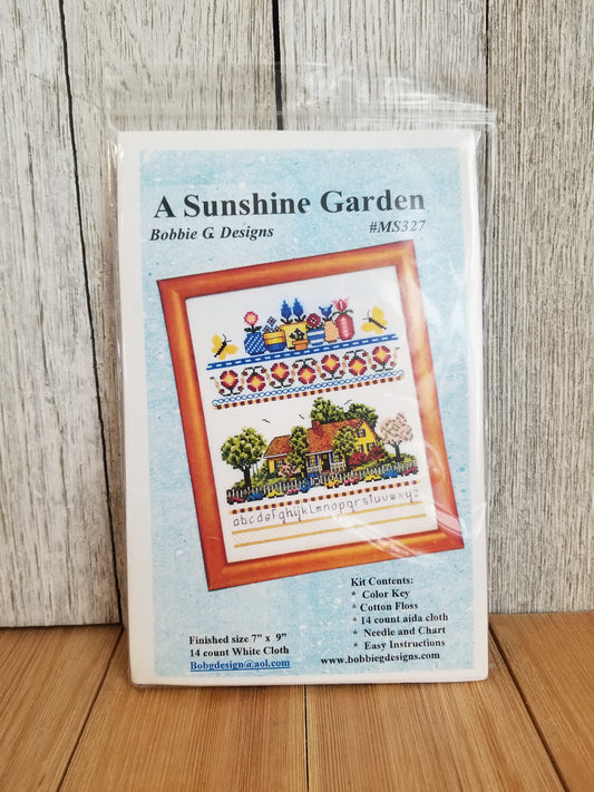 A Sunshine Garden Cross Stitch kit by Bobbie G Designs. Size: 7"x 9"