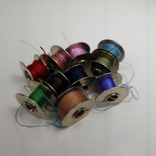 Metal bobbin lot with thread