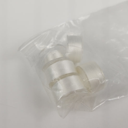 White pre-wound bobbins