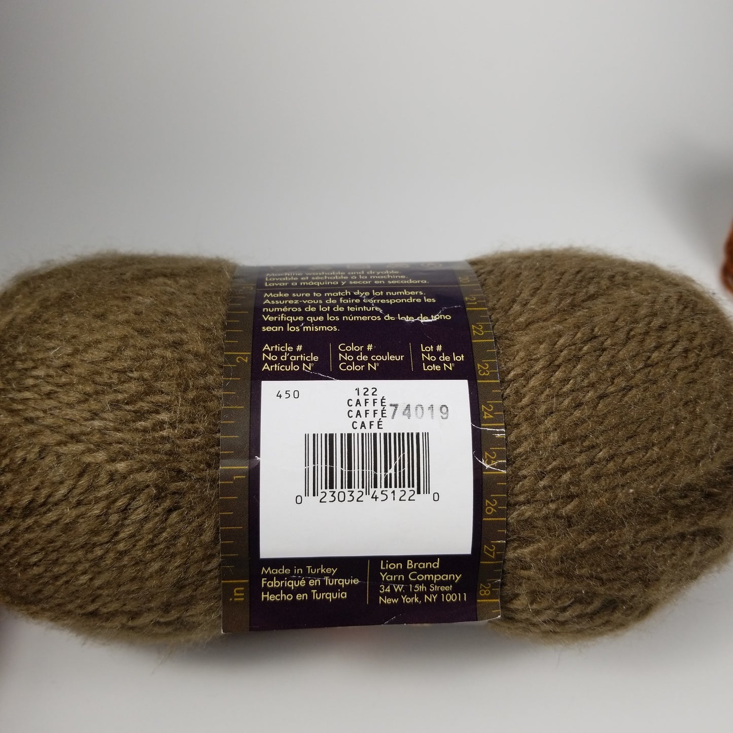 Brown yarn bundle lion brand caffe and mystery brand