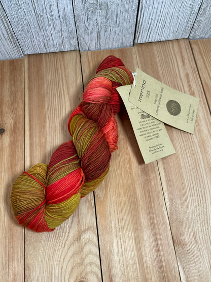 DISCONTINUED Urth Yarns Merino Sock Red and Gold 2031 Hand Painted Fingering Weight Wool Yarn Full Skein