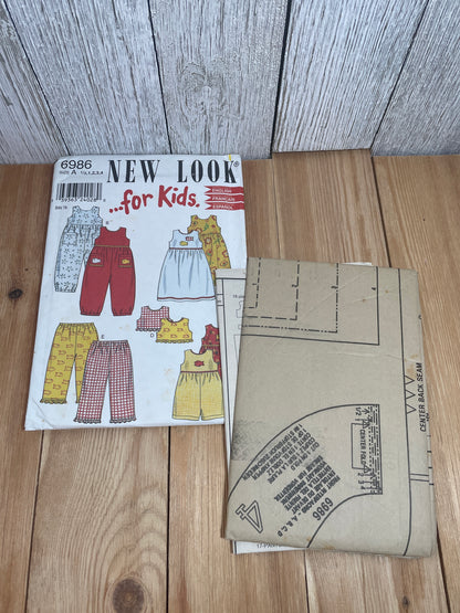 New Look 6986 For Kids Summer Romper, Dress, Stretch Pants, and Tank Top Pattern Size 1/2-4 UNCUT FF