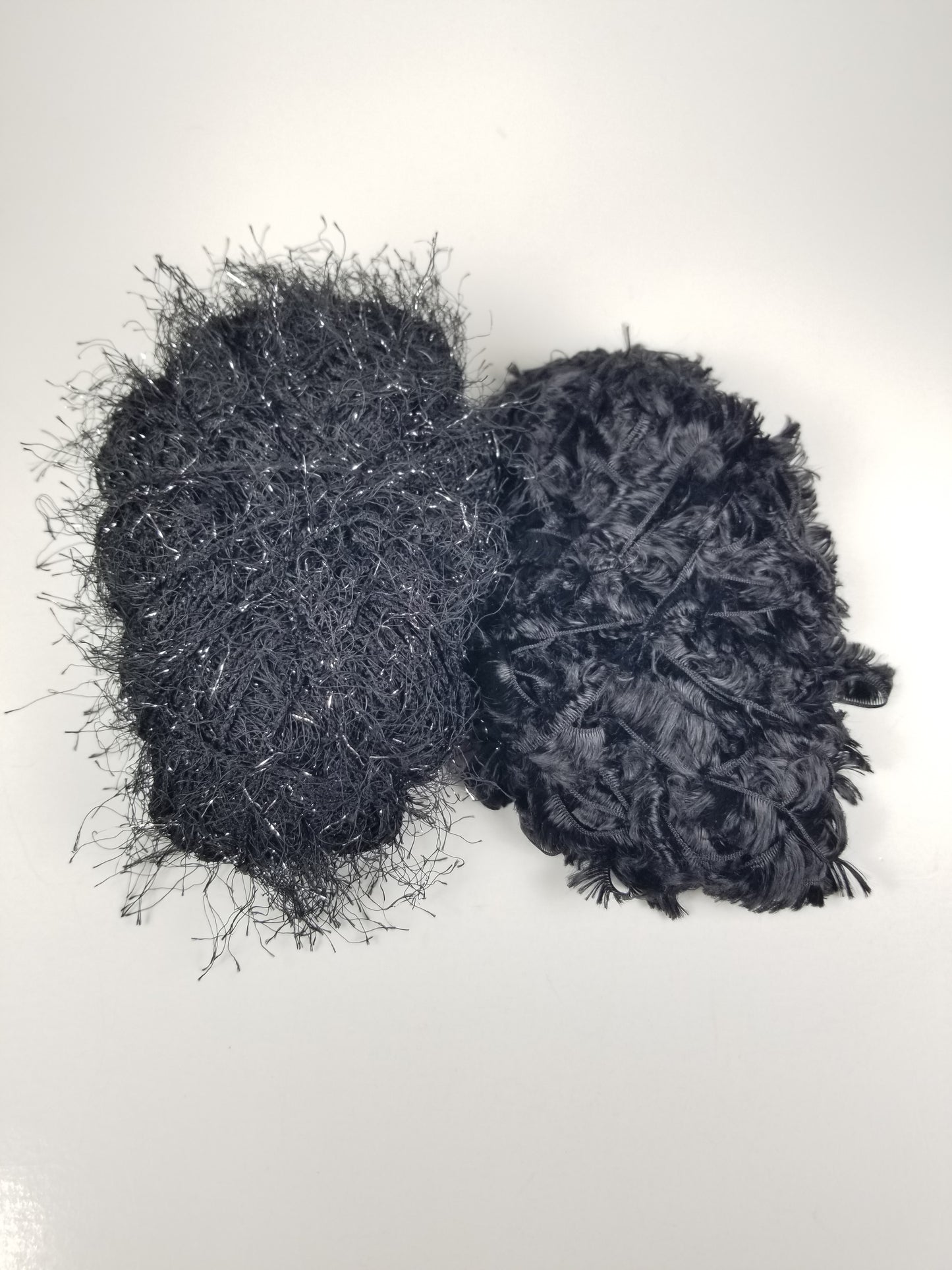 Unlabeled Black Fashion Yarn Bundle (2 skeins) eyelash yarn and black glitter yarn